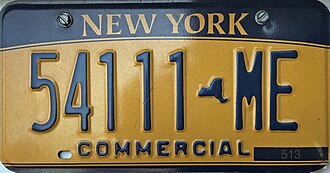 New York commercial truck license plate on a business vehicle
